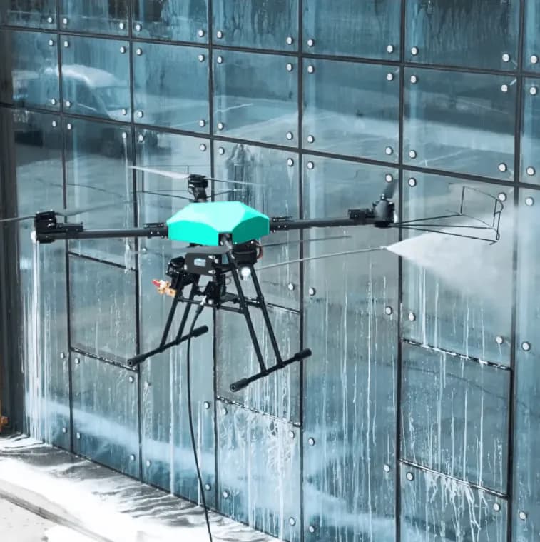 Commercial cleaning drone spraying a glass building facade