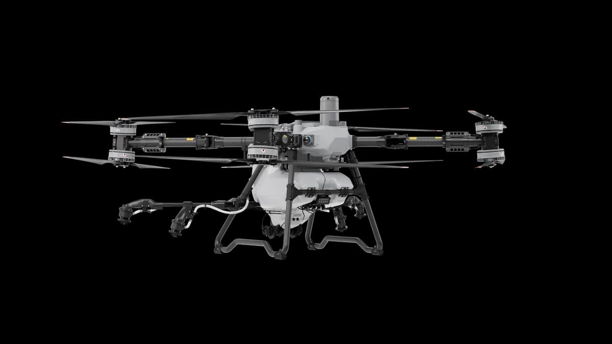DJI AGRAS T100 agricultural drone with spraying system and unfolded rotors