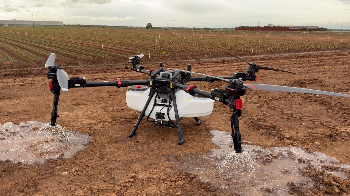 Agricultural spraying drone operating over an Australian field