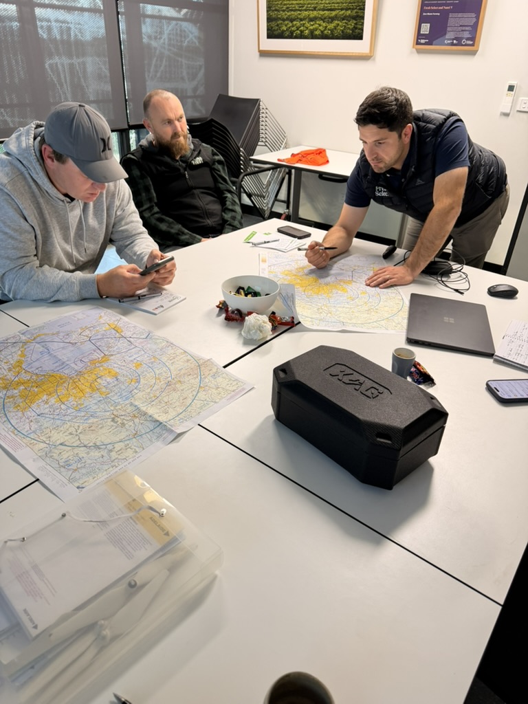 Remote pilot theory session reviewing charts at ACE Aviation