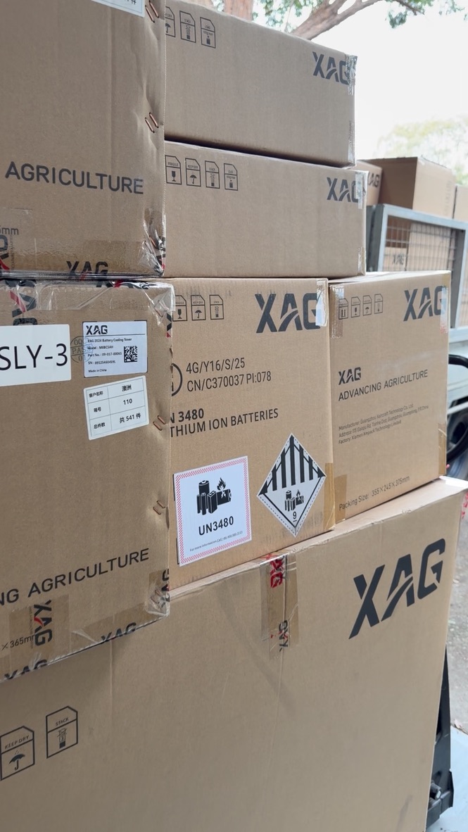 Pallet of boxed XAG enterprise drones and batteries ready for delivery