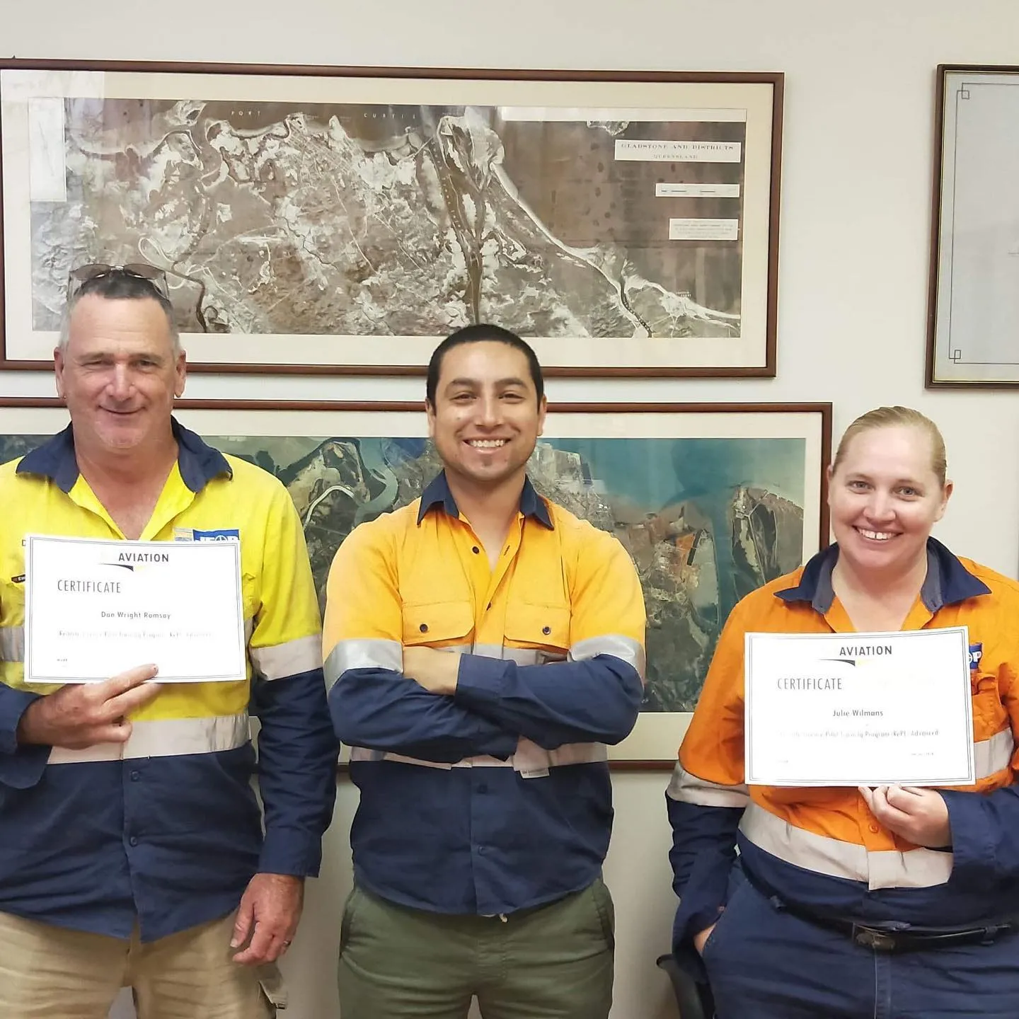 Industry workers holding ACE Aviation RePL certificates after completing training