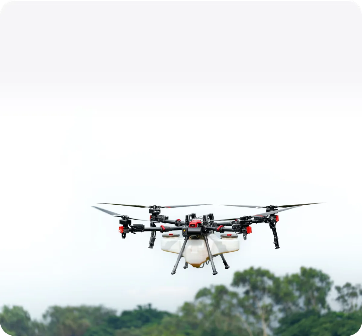 XAG P150 agricultural drone flying above trees